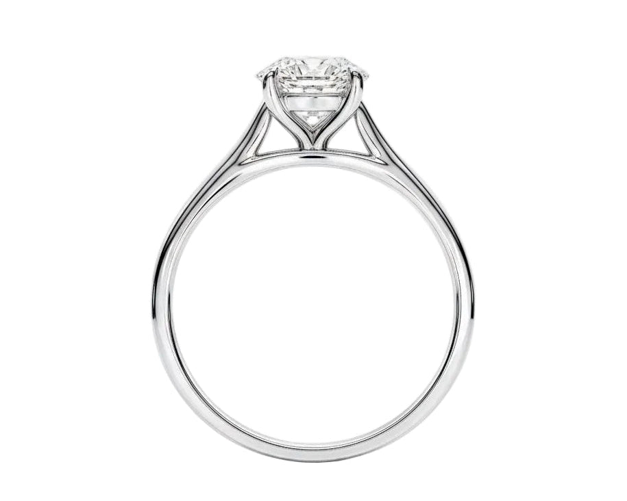 Symmetrical top-down view of a round moissanite solitaire in a polished yellow gold cathedral setting.