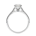Symmetrical top-down view of a round moissanite solitaire in a polished yellow gold cathedral setting.