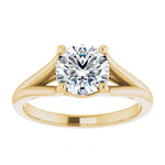 Luxury round brilliant moissanite engagement ring with a cathedral V-split shank in yellow gold ApolloGem South Africa.