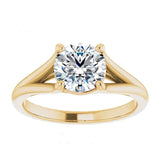 Luxury round brilliant moissanite engagement ring with a cathedral V-split shank in yellow gold ApolloGem South Africa.