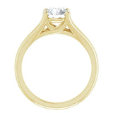 Detailed side view of a round moissanite ring showing the arched cathedral setting and split-shoulder design.