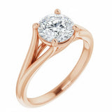 Close-up of a high-quality D-color VVS1 round moissanite in an elegant architectural gold setting.