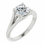 Close-up of a high-quality D-color VVS1 round moissanite in an elegant architectural gold setting.