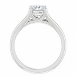 Detailed side view of a round moissanite ring showing the arched cathedral setting and split-shoulder design.