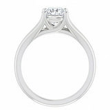 Detailed side view of a round moissanite ring showing the arched cathedral setting and split-shoulder design.