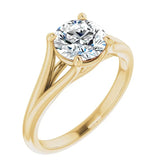 Close-up of a high-quality D-color VVS1 round moissanite in an elegant architectural gold setting.