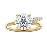 Modern floating round brilliant moissanite ring with a pavé spiral wrap band in yellow gold ApolloGem.