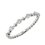 Classic channel-set round brilliant stone half-eternity band in white gold ApolloGem.