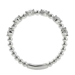 Top-down view of a D-color VVS1 round stone half-eternity wedding band in White gold.