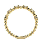 Top-down view of a D-color VVS1 round stone half-eternity wedding band in yellow gold.