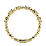 Top-down view of a D-color VVS1 round stone half-eternity wedding band in yellow gold.