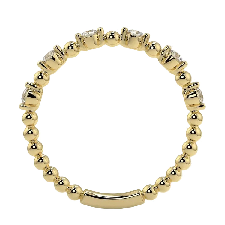 Top-down view of a D-color VVS1 round stone half-eternity wedding band in yellow gold.