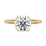 Luxury round brilliant moissanite solitaire engagement ring with double cat-claw prongs in yellow gold ApolloGem South Africa.