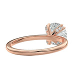 Close-up of a high-quality D-color VVS1 round moissanite secured by polished double cat-claw prongs.
