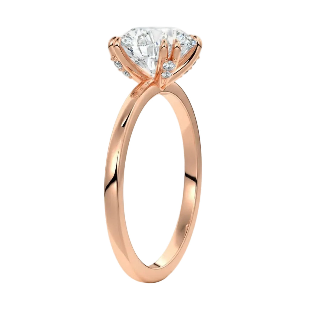 Four-point double-prong round solitaire engagement ring with a high-quality GRI certified stone and accent prongs.