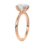 Four-point double-prong round solitaire engagement ring with a high-quality GRI certified stone and accent prongs.