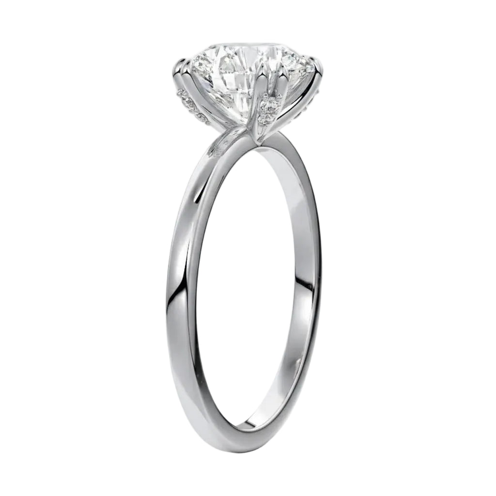 Four-point double-prong round solitaire engagement ring with a high-quality GRI certified stone and accent prongs.