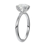 Four-point double-prong round solitaire engagement ring with a high-quality GRI certified stone and accent prongs.