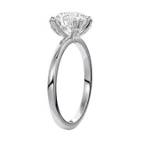 Four-point double-prong round solitaire engagement ring with a high-quality GRI certified stone and accent prongs.