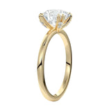 Four-point double-prong round solitaire engagement ring with a high-quality GRI certified stone and accent prongs.