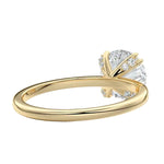 Close-up of a high-quality D-color VVS1 round moissanite secured by polished double cat-claw prongs.