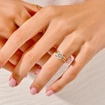 The Round Duo Essence set on a finger showing the elegant slim-line silhouette and brilliant fire.