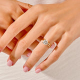 The Round Duo Essence set on a finger showing the elegant slim-line silhouette and brilliant fire.