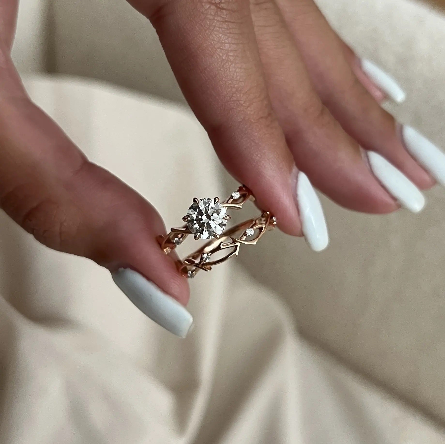 The Round Duo Floral Vine set on a finger showing the artistic textured silhouette and brilliant fire.