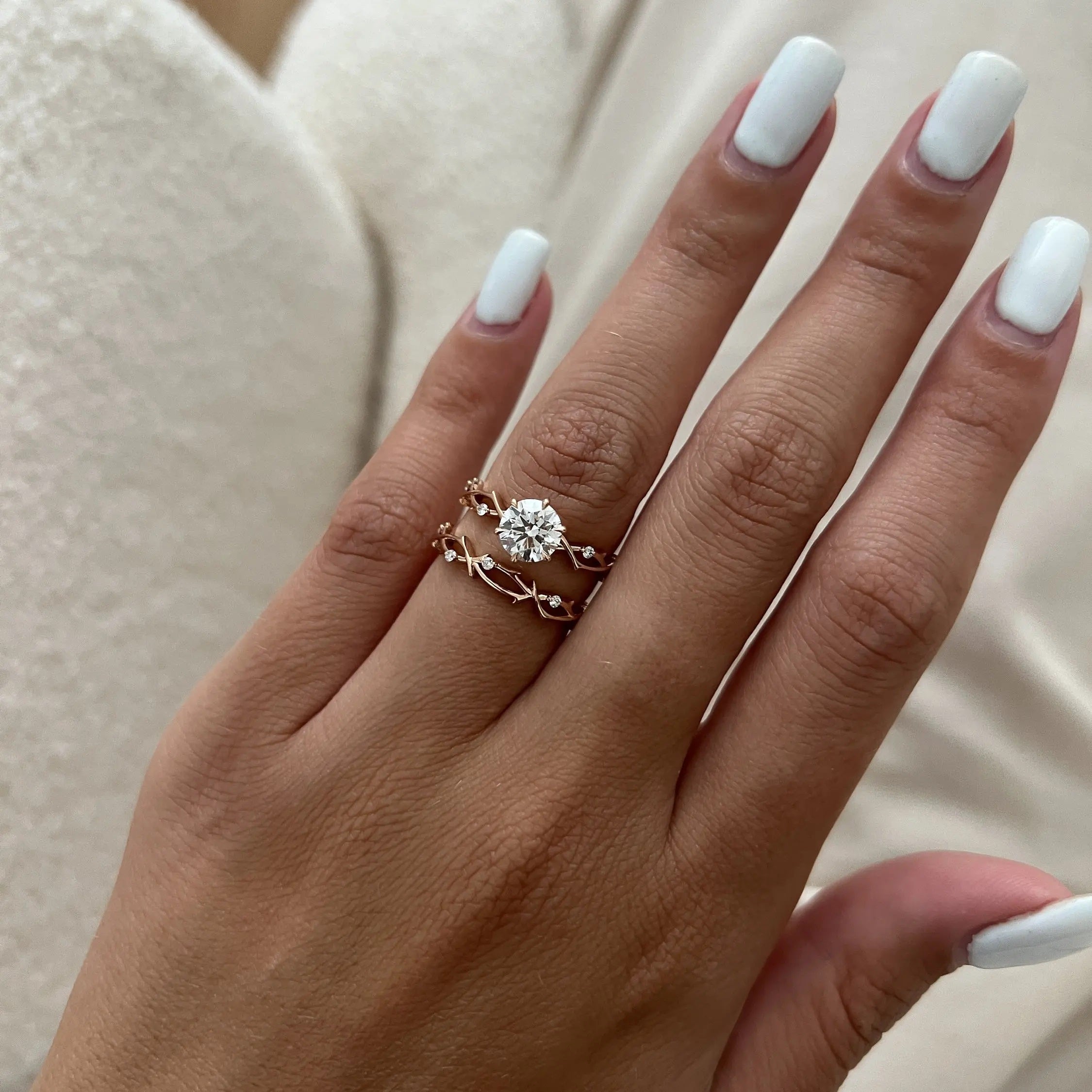 The Round Duo Floral Vine set on a finger showing the artistic textured silhouette and brilliant fire.