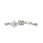 Close-up of a D-color VVS1 round moissanite in a decorative floral Duo Collection setting.