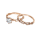 Organic nature-inspired moissanite bridal set with hand-set accent stones in solid rose gold.
