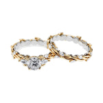 Unique two-tone round brilliant moissanite engagement ring with pear-cut side stones Duo Collection ApolloGem.