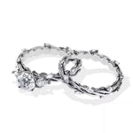 Unique two-tone round brilliant moissanite engagement ring with pear-cut side stones Duo Collection ApolloGem.