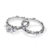 Unique two-tone round brilliant moissanite engagement ring with pear-cut side stones Duo Collection ApolloGem.