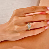 The Round Duo Halo Pavé set on a finger showing the massive sparkle and unified silhouette.