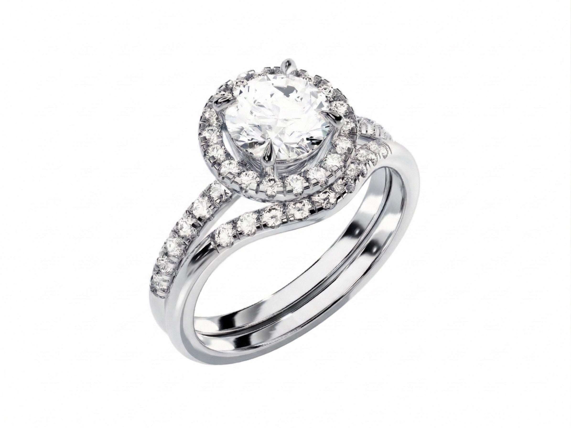 White gold moissanite bridal set with a round halo solitaire and asymmetrical pavé wedding ring.