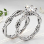 Side profile of the Helix Wrap ring showing micro-pavé stones encircling the moissanite base.