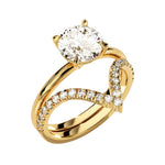 Four-prong round solitaire with decorative leaf-style shoulders and matching v-shaped band.