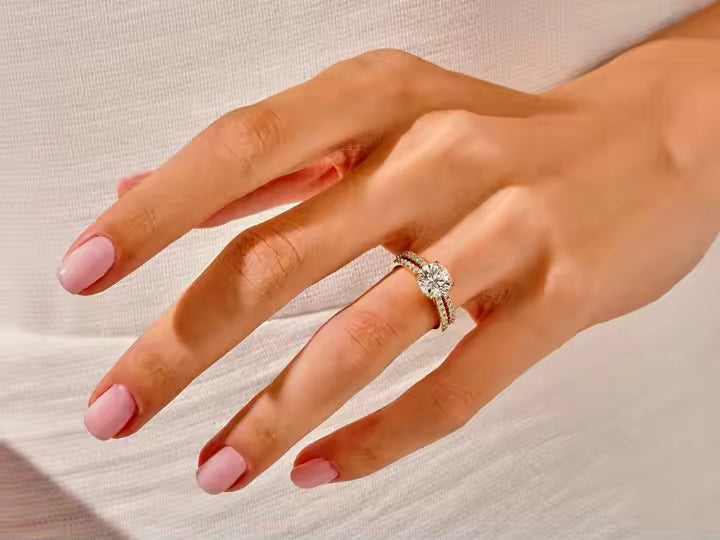 The Round Duo Pavé set on a finger showing unified brilliance and a sophisticated silhouette.