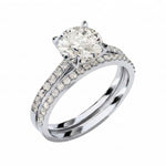 Close-up of a D-color VVS1 round moissanite in a shimmering pavé bridal setting.