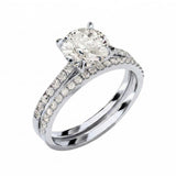 Close-up of a D-color VVS1 round moissanite in a shimmering pavé bridal setting.