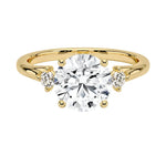 Luxury round brilliant moissanite engagement ring with a decorative stone frame and small side accents ApolloGem South Africa.