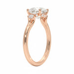 Elegant round brilliant engagement ring showing the side accents and the detail of the decorative frame.