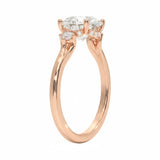 Elegant round brilliant engagement ring showing the side accents and the detail of the decorative frame.