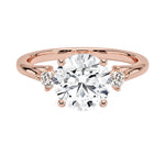 Close-up of a D-color VVS1 round brilliant moissanite with a sparkling micro-set frame at the base of the setting.