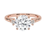 Close-up of a D-color VVS1 round brilliant moissanite with a sparkling micro-set frame at the base of the setting.