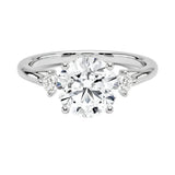 High-resolution jewelry render of a round moissanite ring with a stone-set bridge and polished white gold band.
