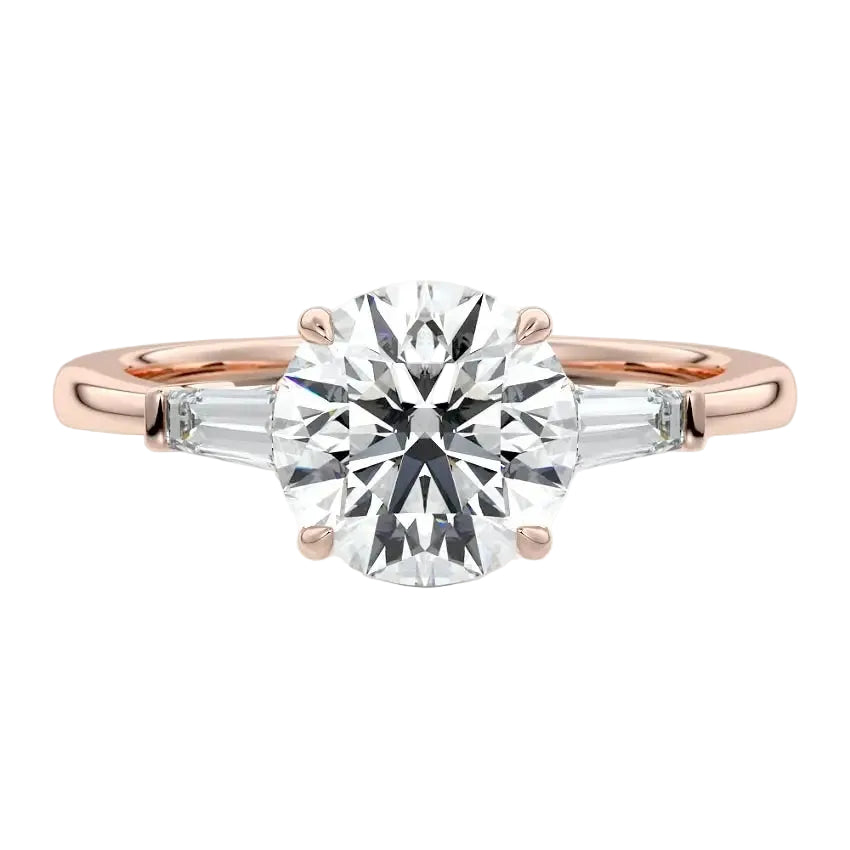 Elegant bridal stack featuring a round three-stone moissanite ring paired with a slim gold wedding band for a luxury look.