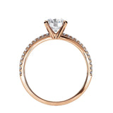 Side profile of the Round Infinity Pavé ring showing both intertwining pavé-set gold bands