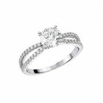 Four-claw round brilliant moissanite ring with a double-row pavé infinity twist band in white gold ApolloGem.